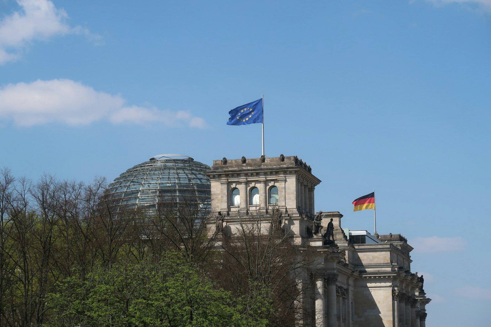 Reichstag building with german and eu flags flying