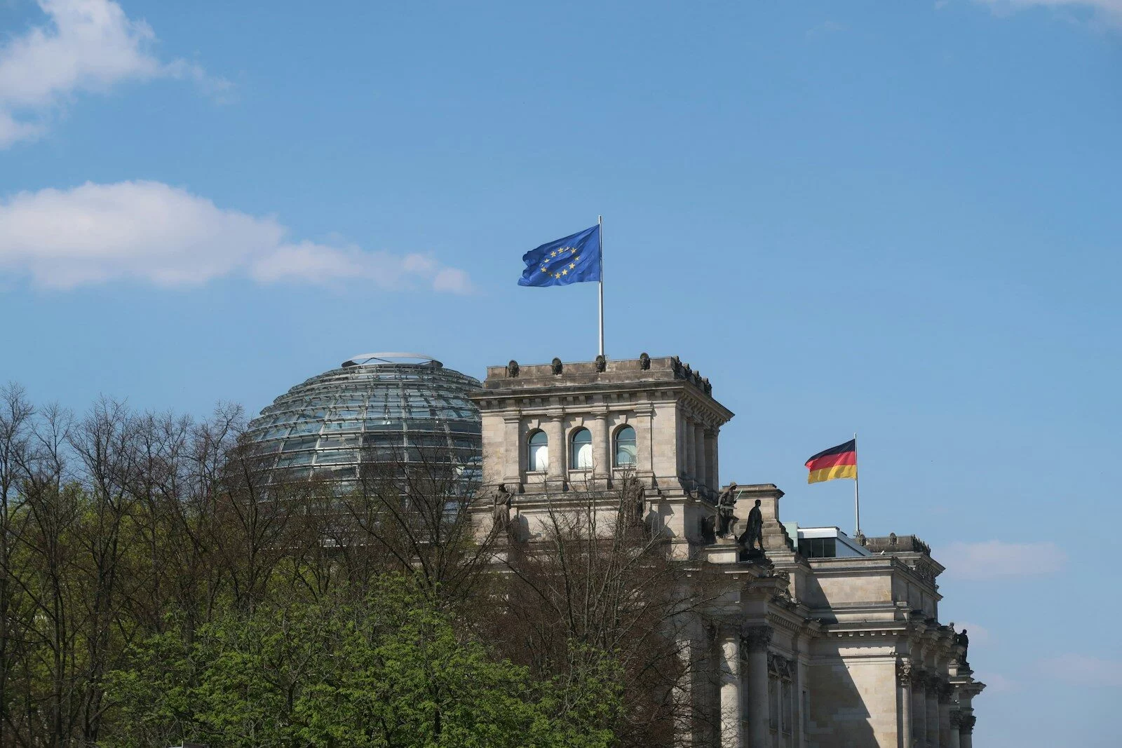 Reichstag building with german and eu flags flying