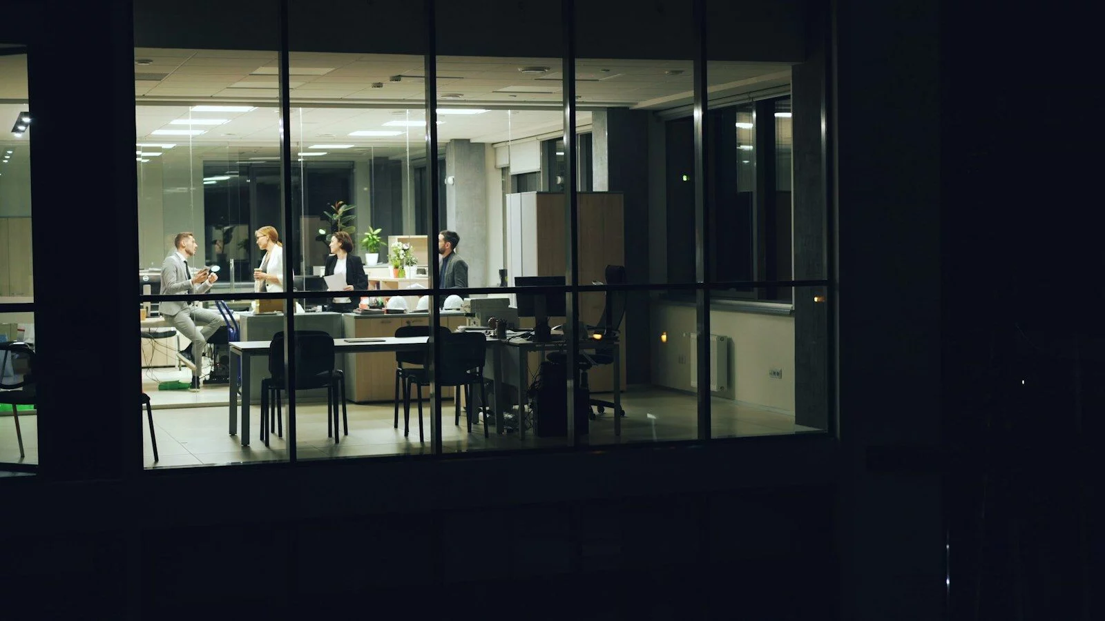 People working late in a modern office at night